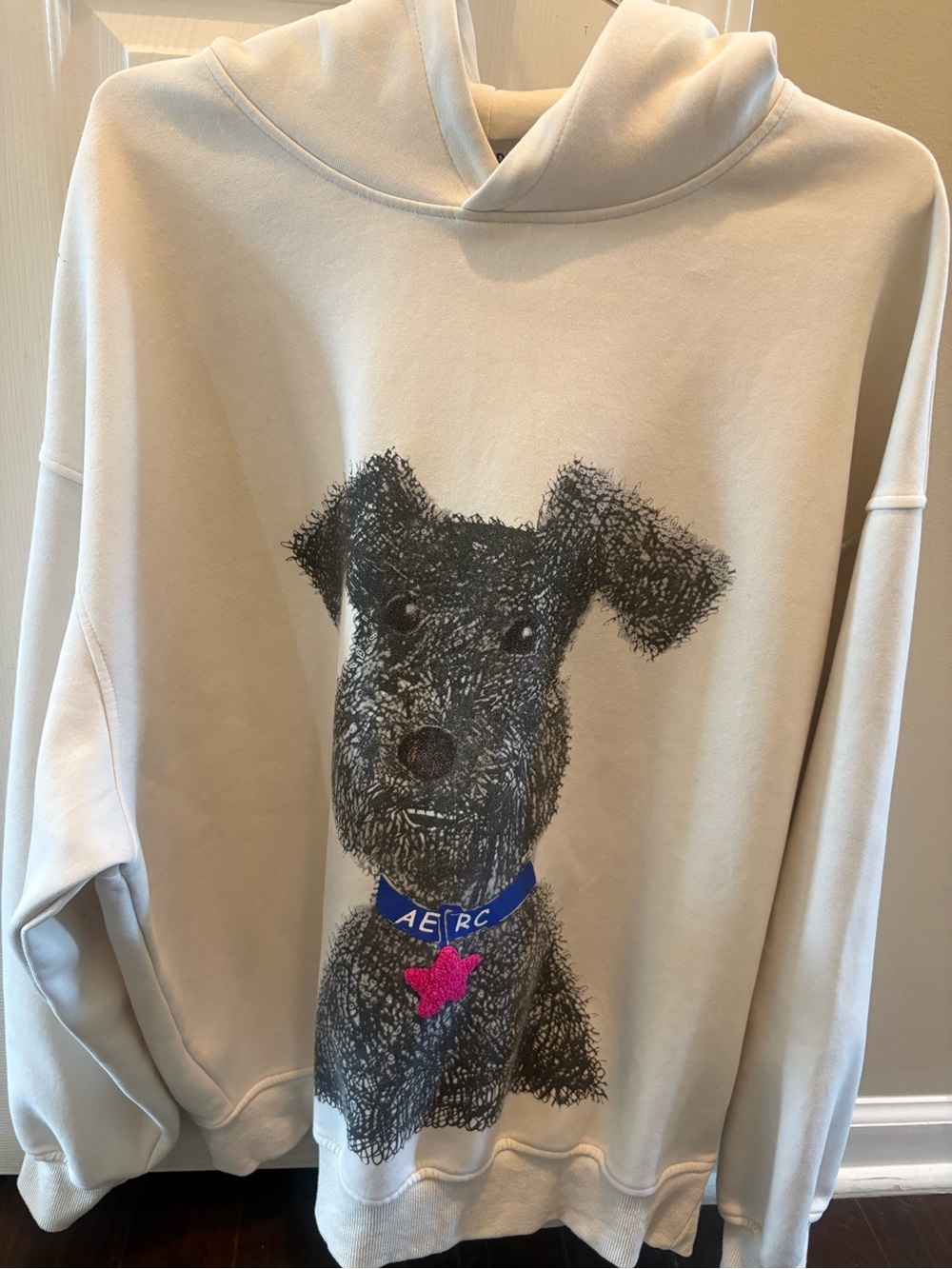 Aelfric Eden Cream Hoodie with Black Dog Graphic and Blue Collar Large